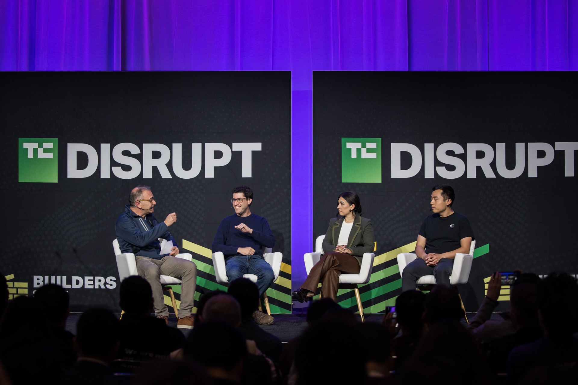TechCrunch Disrupt stage panel, wide view with the audience in the foreground
